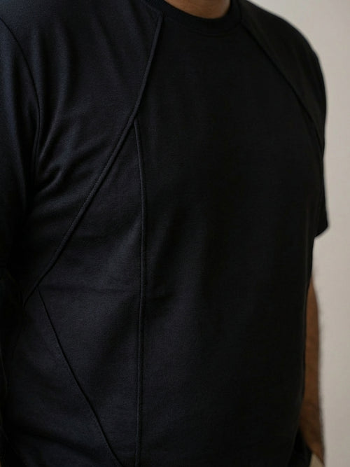 Close-up of panel stitching on structured tee designed for better shape and fit.